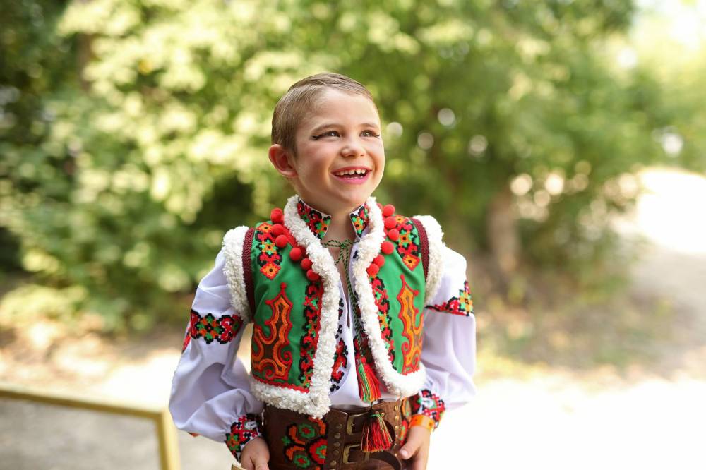 Eight-year-old Rider Gray with Yednist School of Ukrainian Dance laughs backstage before performing in the Hutzul solo male seven to nine years old category in the talent competition during the opening day of Canada’s National Ukrainian Festival at Selo Ukraina south of Dauphin on Friday. The three-day event includes all manner of entertainment and celebration of Ukrainian culture. (Tim Smith/The Brandon Sun)