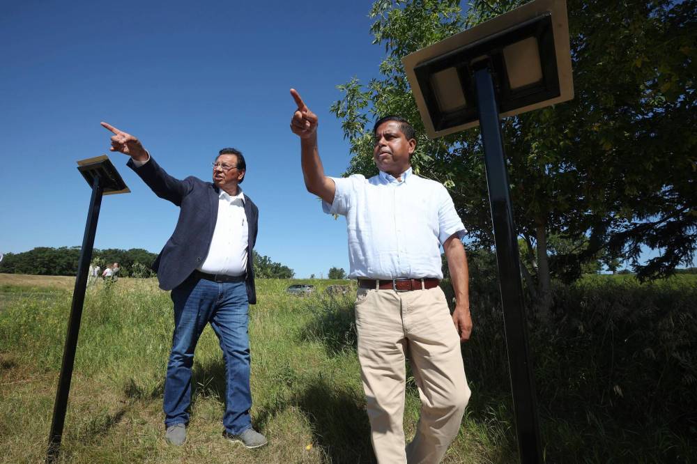 Sioux Valley Dakota Nation Chief Vince Tacan (left) shows Crown-Indigenous Relations Minister Gary Anandasangaree around the site of the former Brandon Indian Residential School on Grand Valley Road on Monday. Anandasangaree was visiting Sioux Valley Dakota Nation as a followup to the federal government's recent apology to the nine Dakota and Lakota First Nations in Canada and their members. (Tim Smith/The Brandon Sun)