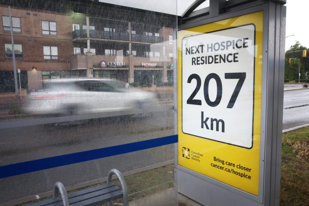 A Victoria Avenue bus stop just outside Superstore sports a poster from the Canadian Cancer Society as part of a campaign to advocate for the creation of a hospice in Brandon. It’s time for Canada’s federal and provincial governments to take the necessary steps to improve access to early screening for cancers, and to do more to ensure that cancer patients are able to focus on their treatment and recovery, not whether they have the money to afford it, Brandon Sun columnist Deveryn Ross writes. (Matt Goerzen/The Brandon Sun)