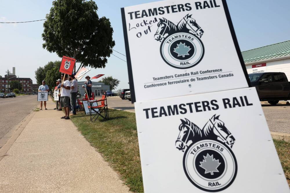 Teamsters Rail signs are propped up as workers picket outside the Canadian Pacific Kansas City Ltd. Brandon general yard office on Friday afternoon. (Tim Smith/The Brandon Sun)