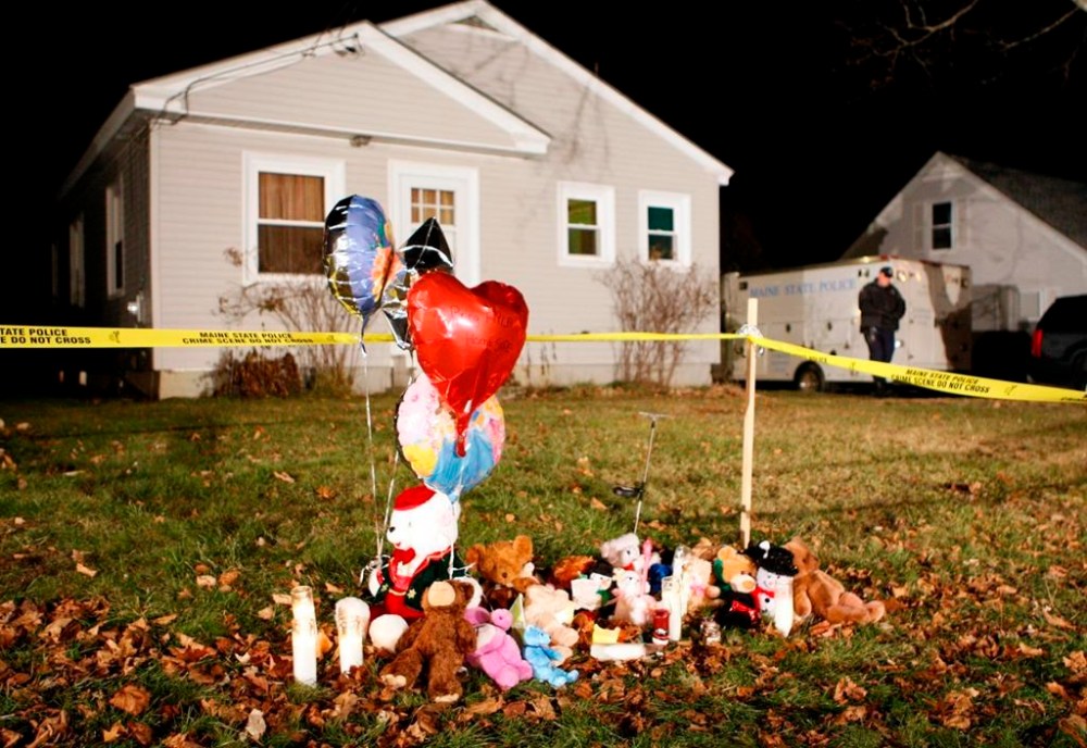 FILE - A memorial grows outside the home of missing 20-month-old Ayla Reynolds, Dec. 22, 2011, in Waterville, Maine. (AP Photo/Robert F. Bukaty, File)