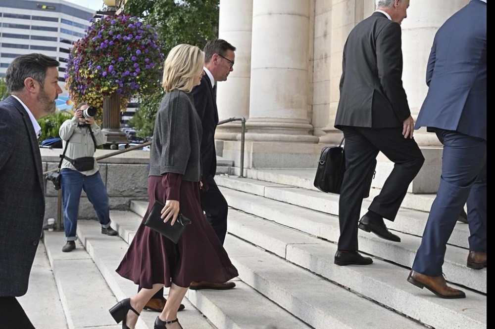 James Murdoch, center, arrives at the Second Judicial District Court in Reno, Nev. on Monday Sept. 16, 2024. (AP Photo/Andy Barron)