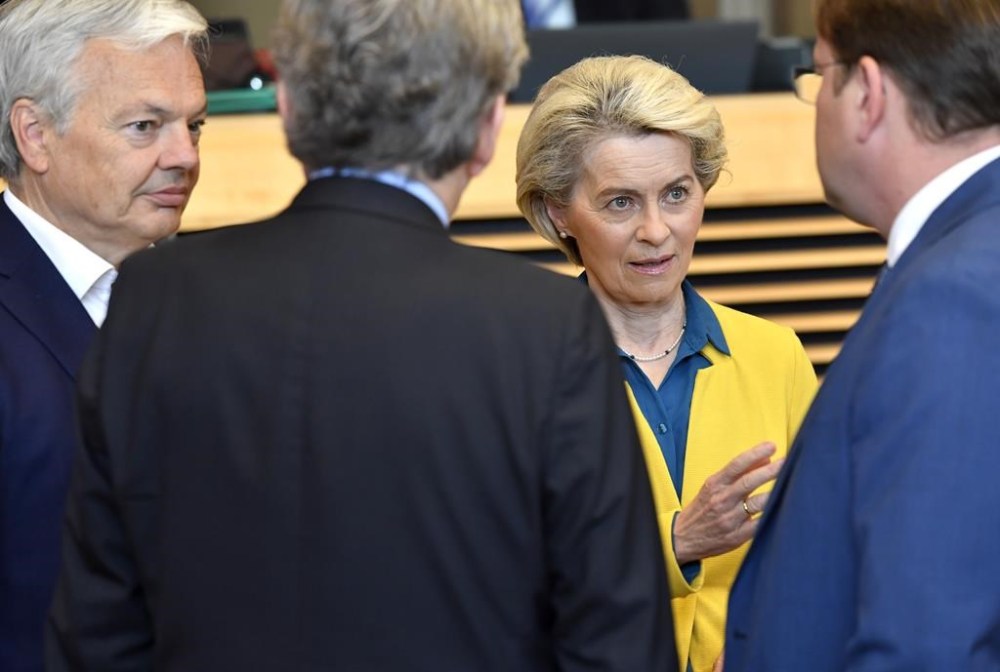 FILE - European Commission President Ursula von der Leyen, second right, speaks with from left, European Commissioner for Justice Didier Reynders, European Commissioner for Internal Market Thierry Breton and European Commissioner for Neighborhood and Enlargement Oliver Varhelyi during a meeting of the College of Commissioners at EU headquarters in Brussels, on June 17, 2022. (AP Photo/Geert Vanden Wijngaert, File)
