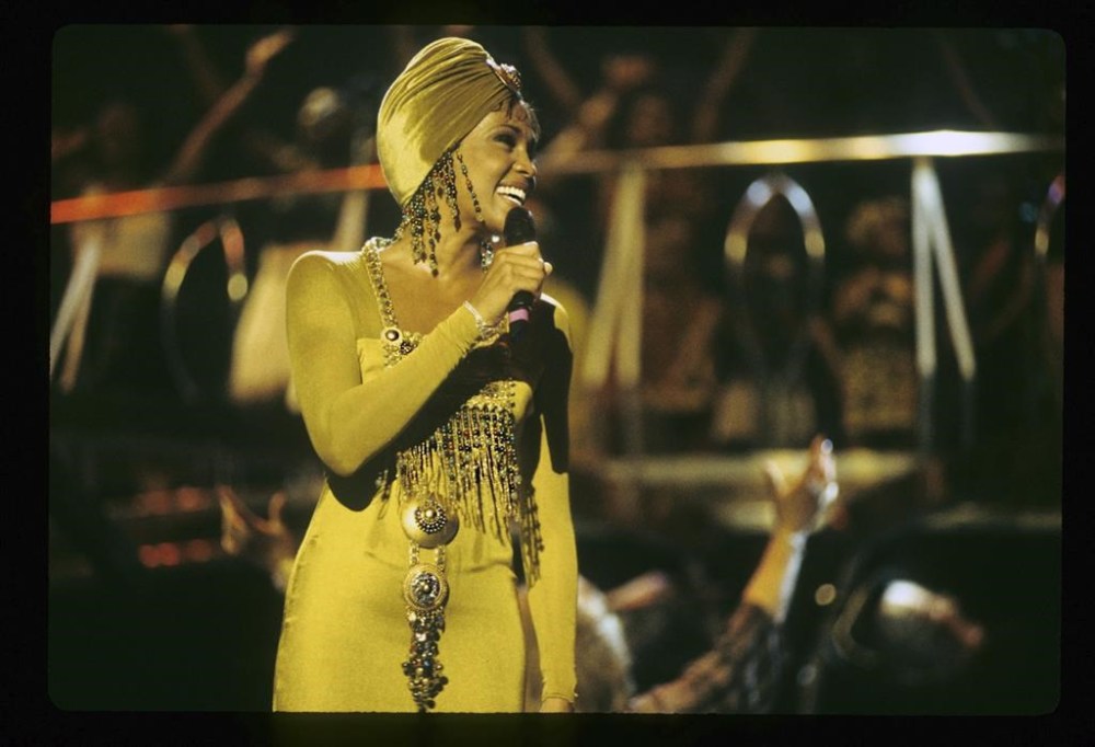 Whitney Houston performs during a concert in Durban, South Africa in 1994. Houston’s epic concert, staged after President Nelson Mandela’s landmark election, will be hitting theater screens this fall. Houston’s 1994 performance has been turned into a fully-remastered theatrical release, called “The Concert for a New South Africa (Durban).” (Neal Preston/Nippy Inc. via AP)