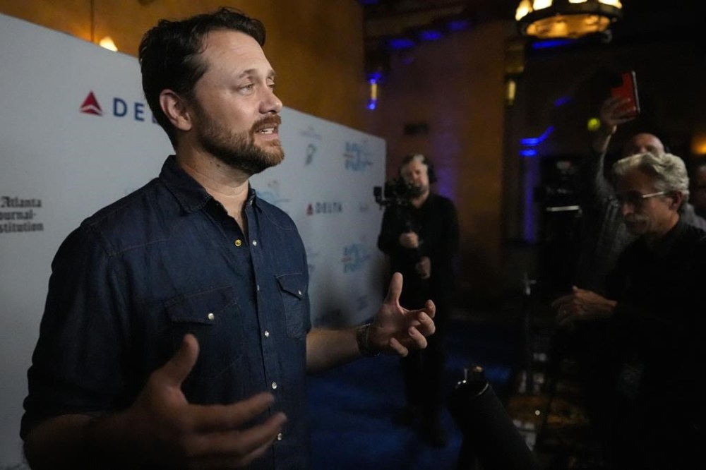 Jason Carter, grandson of President Jimmy Carter, speaks ahead of a