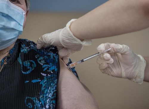 Amanda Parsons, a registered nurse on staff at the Northwood Care facility, administers a dose of the Moderna vaccine to Ann Hicks, 77, in Halifax on Monday, Jan. 11, 2021. Health Canada has authorized Novavax's updated COVID-19 vaccine. THE CANADIAN PRESS/Andrew Vaughan-Pool