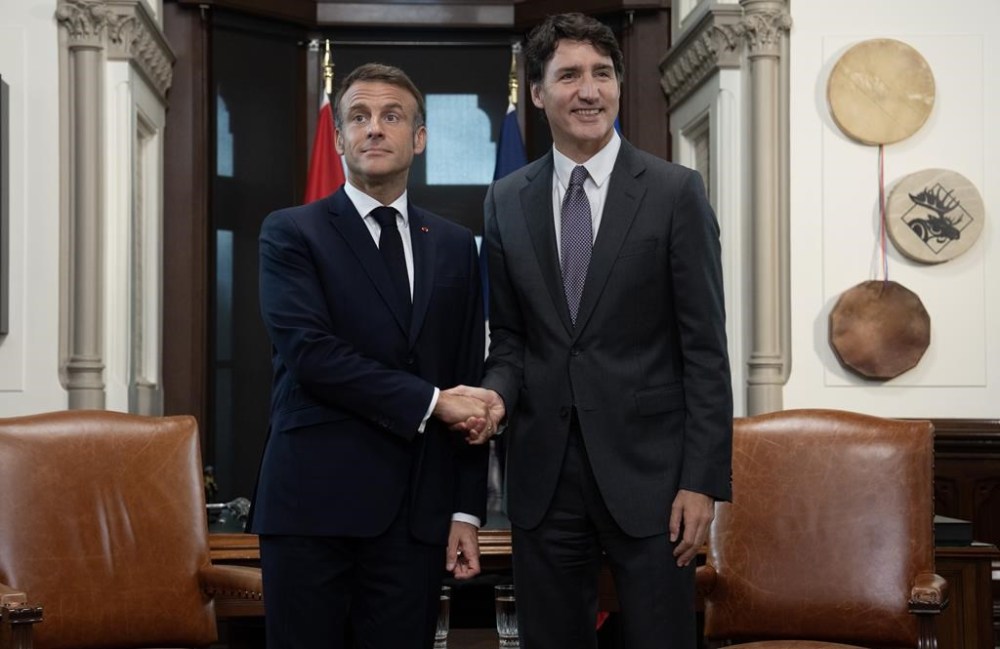 Prime Minister Justin Trudeau, right, and French President Emmanuel Macron shake hands before meeting on Parliament Hill, Thursday, Sept. 26, 2024 in Ottawa. THE CANADIAN PRESS/Adrian Wyld