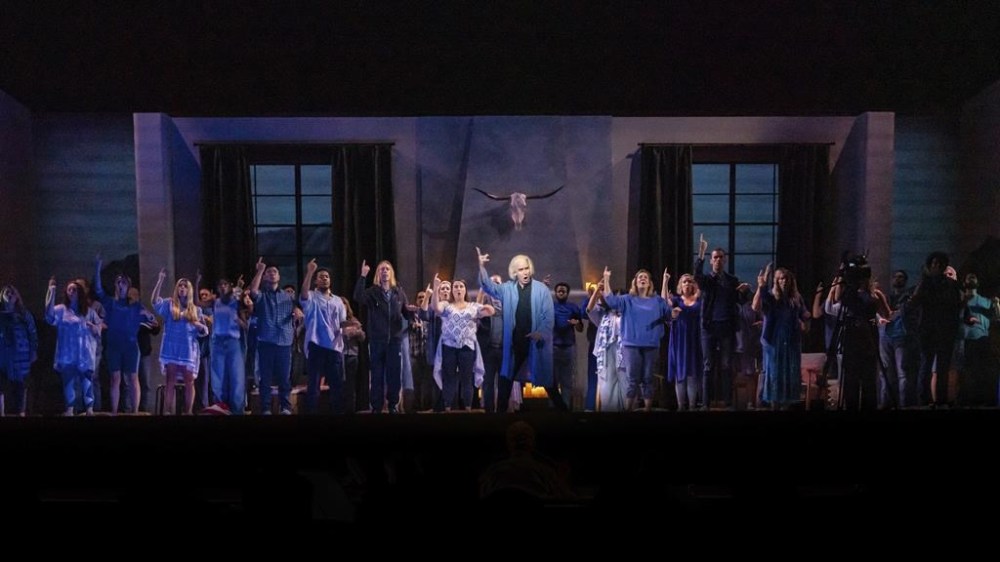 This image released by Opera Philadelphia shows Kevin Burdette, center, and the cast during a performance of