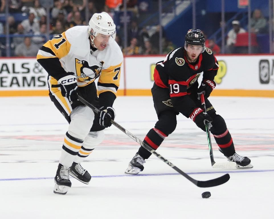 Pittsburgh Penguins centre Evgeni Malkin (71) makes a break for the net as Ottawa Senators right wing Drake Batherson (19) looks on during first period NHL pre-season hockey action in Sudbury, Ont., Sunday, Sept. 29, 2024. THE CANADIAN PRESS/Gino Donato