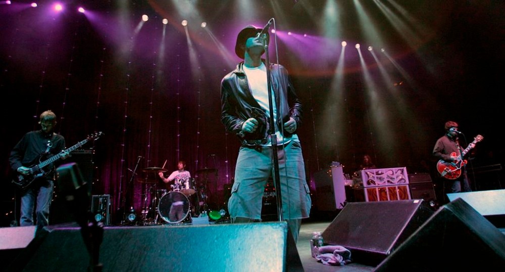 FILE - The British rock band Oasis performs at the Tweeter Center in Mansfield, Mass., Friday, June 24, 2005. (AP Photo/Robert E. Klein, File)