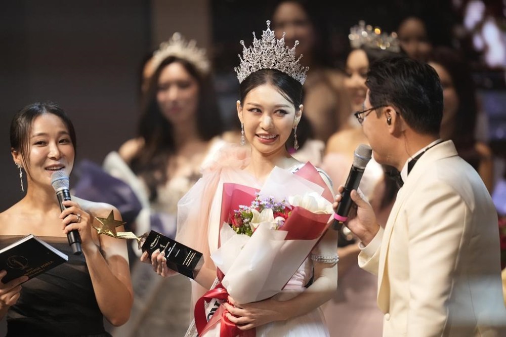 Han Ariel, a 22-year-old fashion school student, celebrates after winning the 2024 Miss Universe Korea in Seoul, South Korea, Monday, Sept. 30, 2024. (AP Photo/Lee Jin-man)