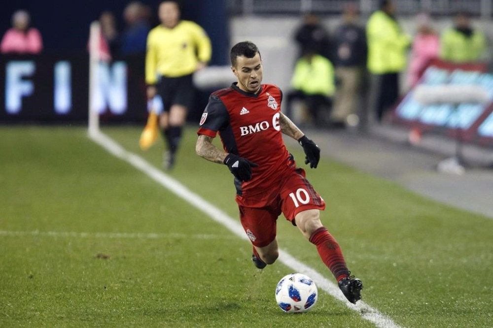 Toronto FC forward Sebastian Giovinco (10) keeps the ball in bounds as he runs up field during MLS soccer action against the Atlanta United in Toronto, Sunday, Oct. 28, 2018. THE CANADIAN PRESS/Cole Burston