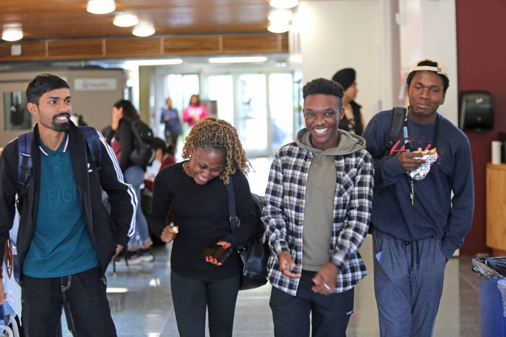 Assiniboine College international students Zanhong Xin from China (from left), Titilope Ajao from Nigeria, Harpreet Singh from India, Haonan Li from China and Manpreet Singh take selfie during the May orientation program. (File)