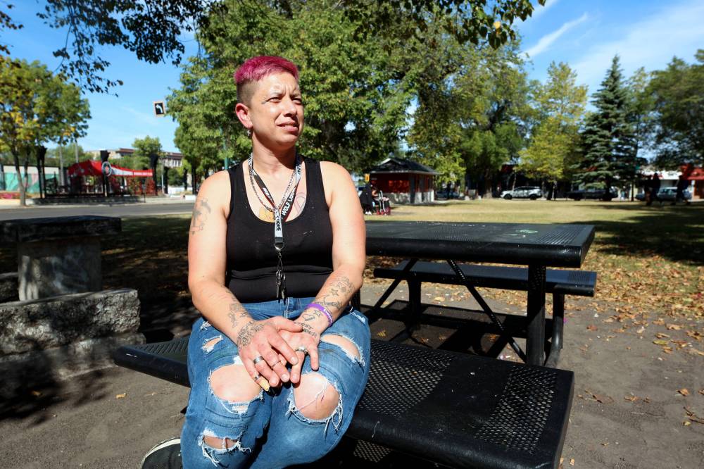 Kat, who requested her last name not be used, sits at a picnic table at Princess Park on Saturday. A while ago, she sent a sample of meth for testing after feeling unexpected side effects from using it. The sample turned out to be 21 per cent fentanyl. (Colin Slark/The Brandon Sun)