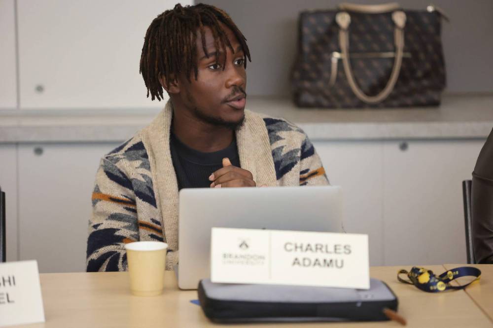 Brandon University Student Union president Charles Adamu shares concerns in 24-hour/week work restrictions for international students during the university’s Board of Governors regular meeting on Saturday morning. (Abiola Odutola/The Brandon Sun)