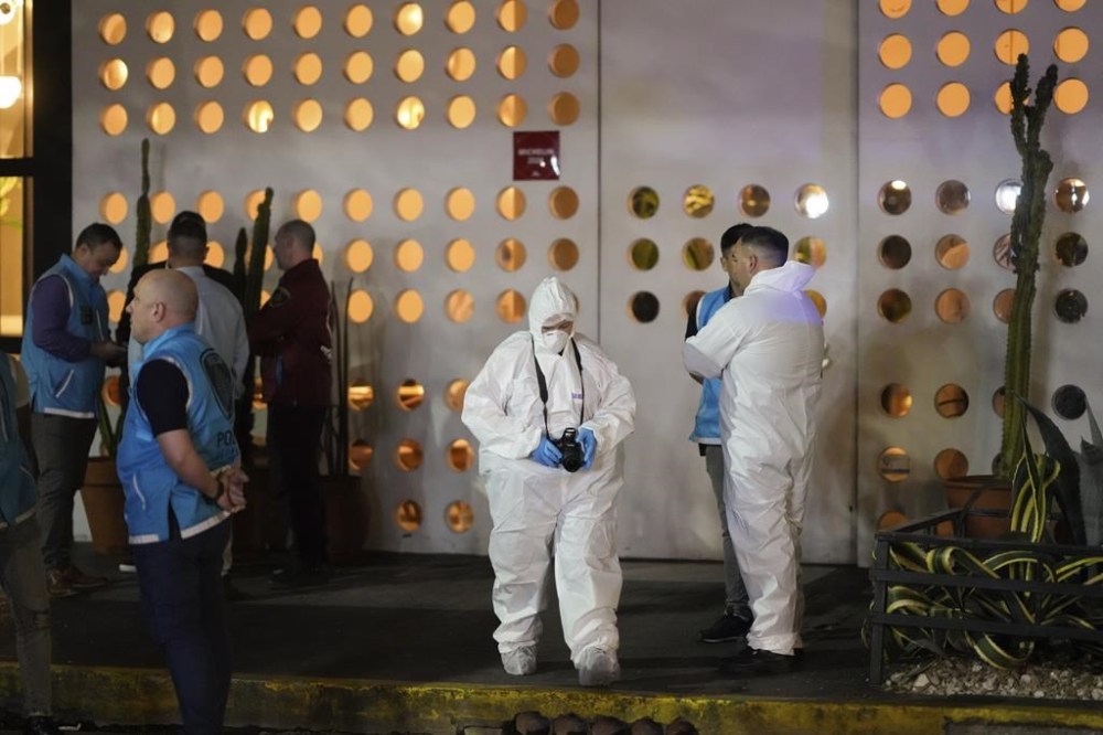 Forensic investigators exit the hotel where former One Direction singer Liam Payne, was found dead after falling from a balcony in Buenos Aires, Argentina, Wednesday, Oct. 16, 2024. (AP Photo/Natacha Pisarenko)