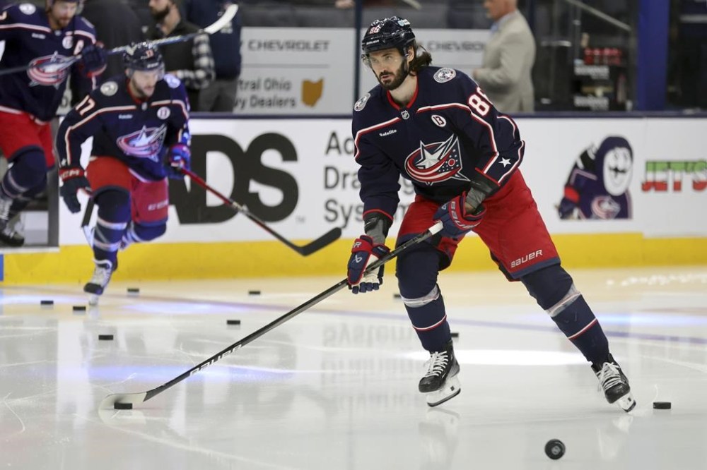 Columbus Blue Jackets forward Kirill Marchenko warms up before an NHL hockey game against the Toronto Maple Leafs in Columbus, Ohio, Tuesday, Oct. 22, 2024. (AP Photo/Paul Vernon)