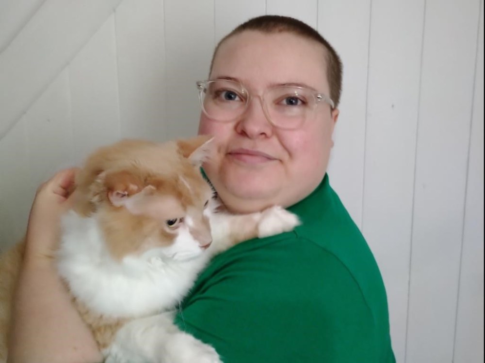 Heather Thompson, pictured with their emotional support cat Captain Kirk in this recent handout photo, hoped the Canada Disability Benefit would help them out of poverty, but that hope has been dashed. THE CANADIAN PRESS/HO - Heather Thompson