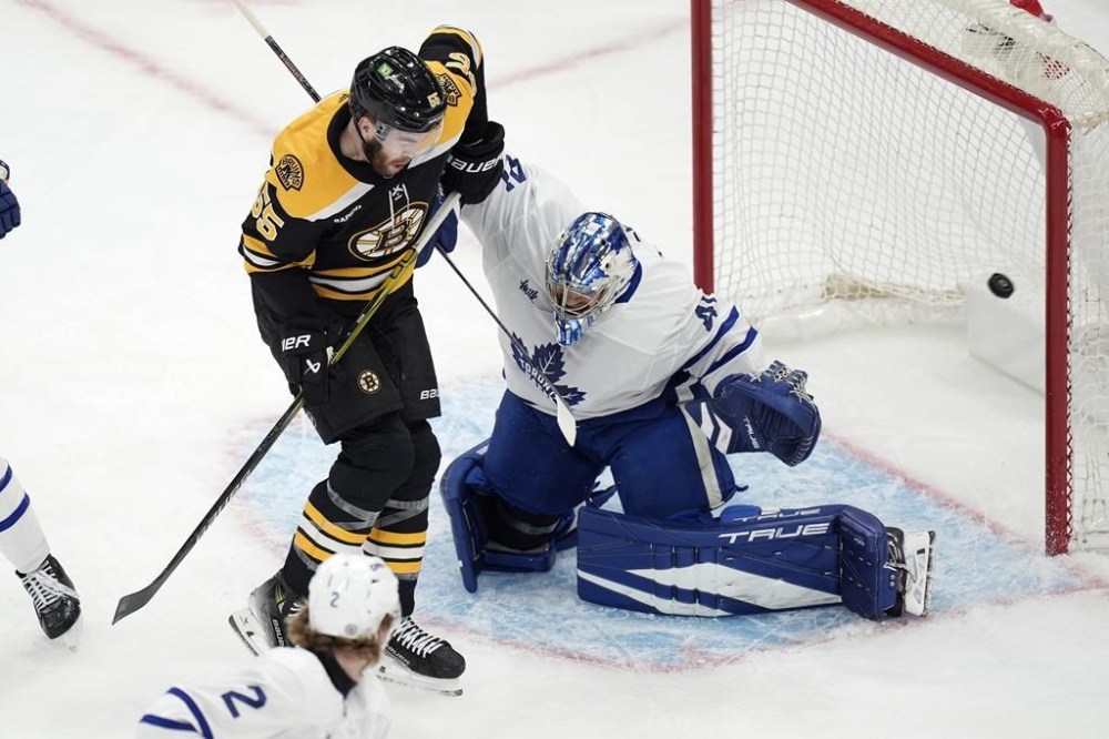 Marchand gets 1st goal of season in OT to lift Bruins to 43 win over