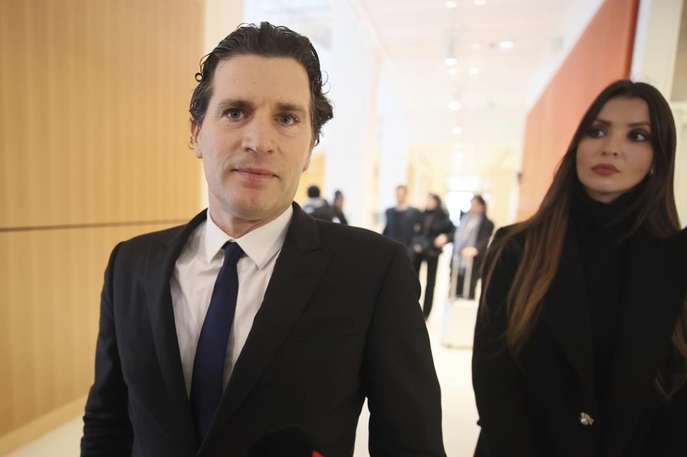 Jeremie Assous, left, the lawyer for French actor Gerard Depardieu, arrives at the courtroom while Depardieu, who is facing trial for the alleged sexual assaults of two women on a film set in 2021, won't appear before a criminal court, Monday, Oct. 28, 2024 in Paris. (AP Photo/Thomas Padilla)