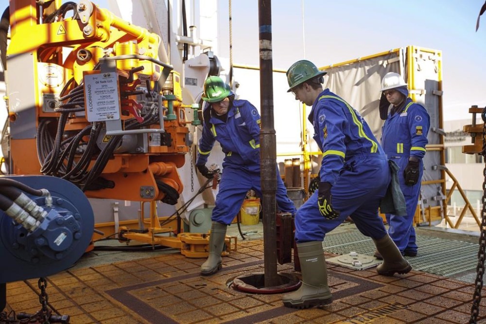 Trainees Dan Brook and Bradley Williams are directed by instructor Clint Dyck while training to lay down drill pipe on a rig floor, at Precision Drilling in Nisku, Alta., on January 20, 2016. Precision Drilling Corp. says it earned $39 million in the third quarter of 2024, nearly double what it earned in the same period last year. THE CANADIAN PRESS/Jason Franson