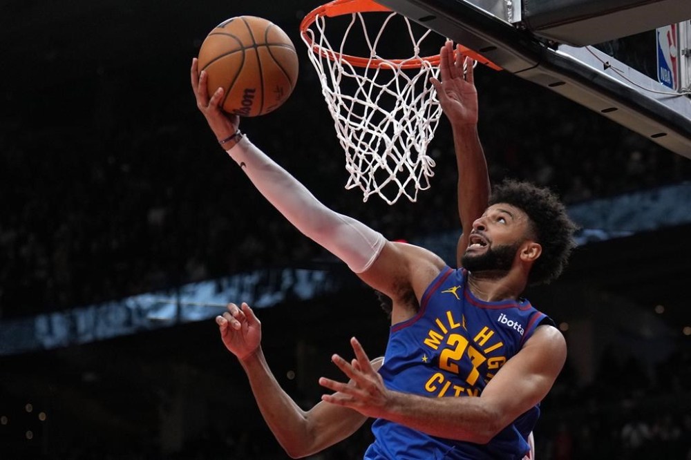Ask any Canadian playing in the NBA about Vince Carter and they'll tell you they're there because of him. Denver Nuggets guard Jamal Murray (27) scores the game-tying basket during second-half NBA basketball action against the Toronto Raptors, in Toronto, Monday, Oct. 28, 2024. THE CANADIAN PRESS/Nathan Denette