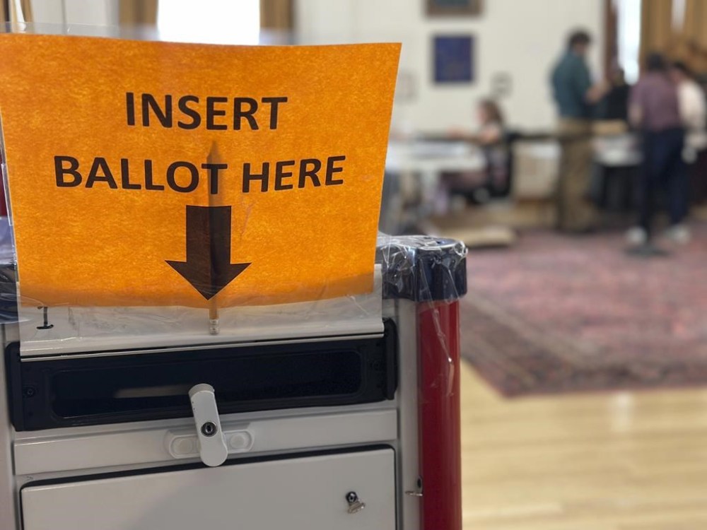 Election workers process absentee ballots at Portland City Hall on Monday, Nov. 4, 2024, in Portland, Maine. (AP Photo/David Sharp)