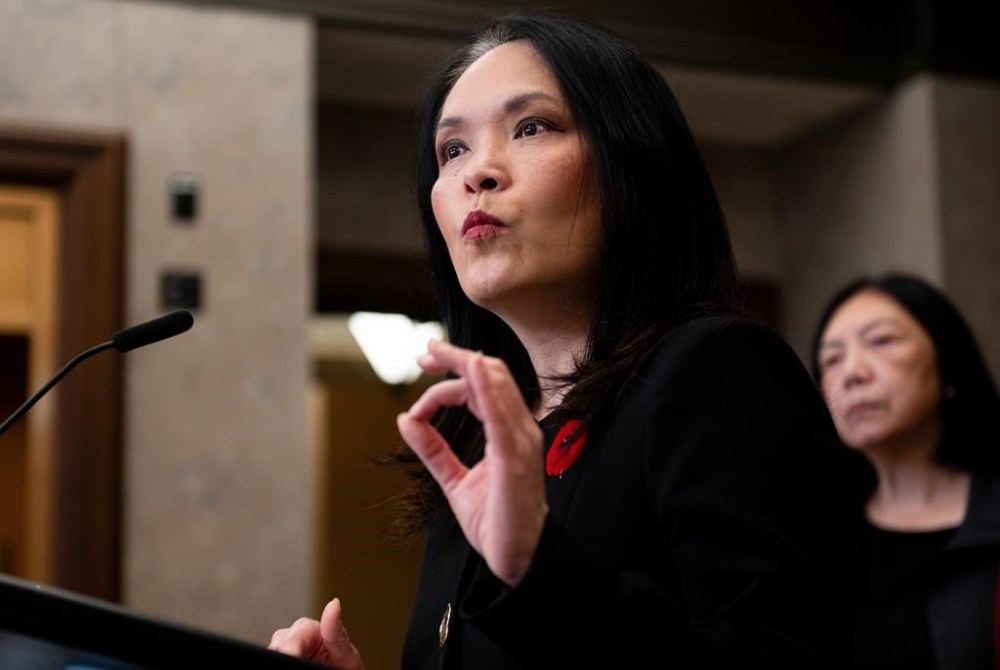 NDP MP and Immigration, Refugees and Citizenship critic Jenny Kwan delivers remarks announcing the NDP's plan to end the exploitation of migrant workers in Canada in the foyer of the House of Commons in Ottawa, on Thursday, Nov. 7, 2024. THE CANADIAN PRESS/Spencer Colby