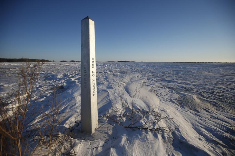 FILE - A border marker, between the United States and Canada is shown just outside of Emerson, Manitoba, on Thursday, Jan. 20, 2022. (John Woods/The Canadian Press via AP, File)
