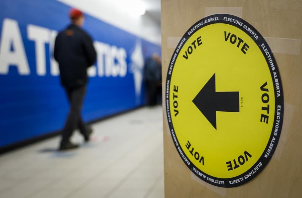 Voters line-up to cast their ballots in a byelection in Medicine Hat, Alta., Tuesday, Nov. 8, 2022. Voters in Lethbridge are facing the first byelection to be held in the province so close to Christmas since Dec. 14, 2017, as Elections Alberta also tries to work around the impact of the Canada Post strike. THE CANADIAN PRESS/Jeff McIntosh