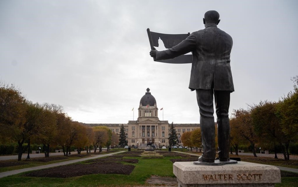 The Saskatchewan legislative building in front of Walter Scott Memorial in Regina on Thursday, Oct. 24, 2024. THE CANADIAN PRESS/Heywood Yu