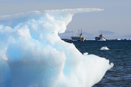 Ships are framed by pieces of melting sea ice in Frobisher Bay in Iqaluit, Nunavut on Wednesday, July 31, 2019. Canada has unveiled its Arctic foreign policy, with a commitment on increased collaboration domestically and internationally to combat emerging foreign threats in the Arctic. THE CANADIAN PRESS/Sean Kilpatrick