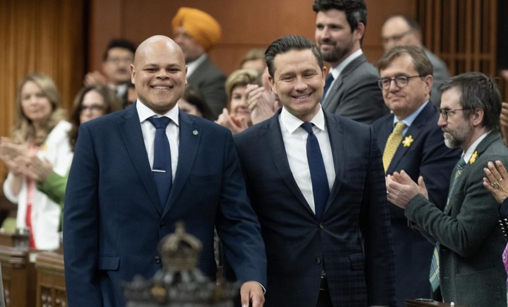 Leader of the Conservative Party Pierre Poilievre walks with new Member of Parliament for Durham Jamil Jivani as he takes his place in the House of Commons before Question Period, Monday, April 8, 2024 in Ottawa. A Conservative member of parliament has tapped a longtime friendship to connect with Donald Trump's inner circle as Canada prepares for the president-elect’s return to the White House next month amid threats of devastating tariffs. THE CANADIAN PRESS/Adrian Wyld