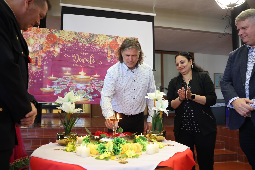 Brandon Mayor Jeff Fawcett lights a candle as part of Diwali celebrations at Brandon City Hall with members of the Wheat City’s Hindu community on Friday. Diwali celebrations started Thursday evening. The community is holding a big celebration on Nov. 9 at the Keystone Centre’s UCT Pavilion. The Disco Diwali 2024 event will feature music, food and dance. (Tim Smith/The Brandon Sun)