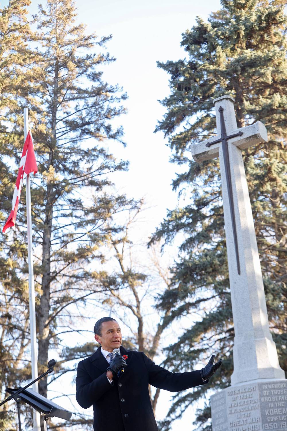Premier Wab Kinew speaks at the Brandon war memorial during Tuesday’s No Stone Left Alone ceremony.