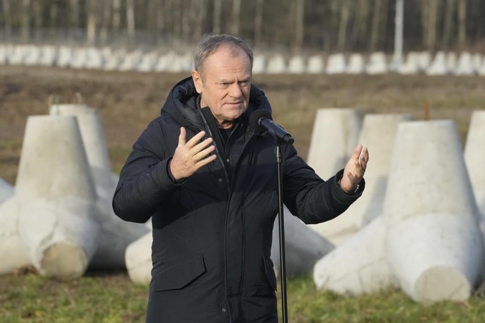Poland's Prime Minister Donald Tusk speaks to reporters in Dabrowka, Poland, during a visit to Poland's border with Russia on Saturday Nov. 30, 2024. (AP Photo/Czarek Sokolowski)