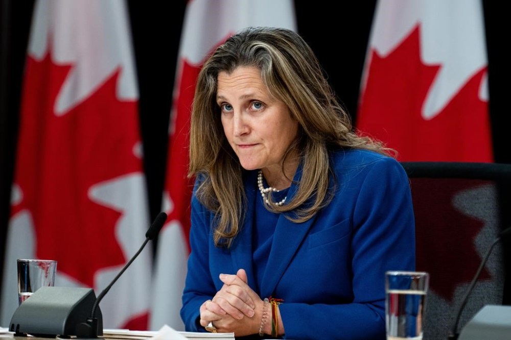 Minister of Finance and Deputy Prime Minister Chrystia Freeland listens to a question from a reporter (not seen) during a press conference at the National Press Theatre in Ottawa on December 3, 2024. THE CANADIAN PRESS/Spencer Colby