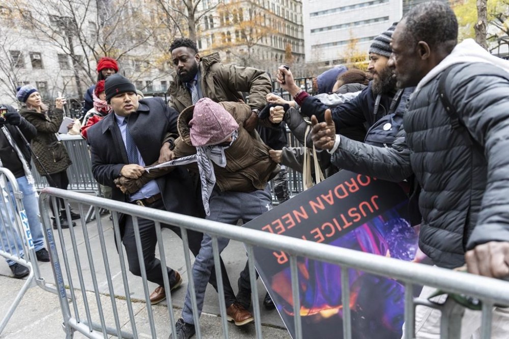 A person protesting the not guilty verdict of Daniel Penny is arrested by police outside the criminal court, Monday, Dec. 9, 2024, in New York. (AP Photo/Stefan Jeremiah)