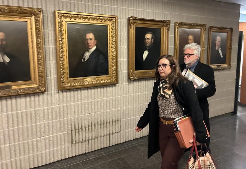 Just for Laughs founder Gilbert Rozon and one of his lawyers, Mélanie Morin, are seen leaving the Montreal courthouse during a break in proceedings on Monday, Dec. 9, 2024. THE CANADIAN PRESS/Sidhartha Banerjee