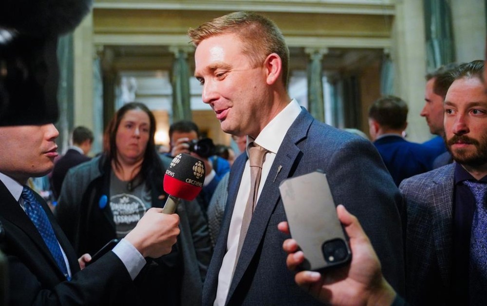 Jeremy Cockrill, then-Saskatchewan Minister of Education, speaks to members of the media after the release of the budget in Regina, Wednesday, March 20, 2024. THE CANADIAN PRESS/Heywood Yu