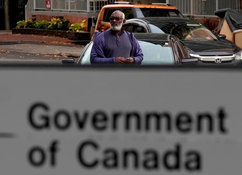 Abousfian Abdelrazik makes his way to Federal court in Ottawa on Oct. 30, 2024. THE CANADIAN PRESS/Adrian Wyld