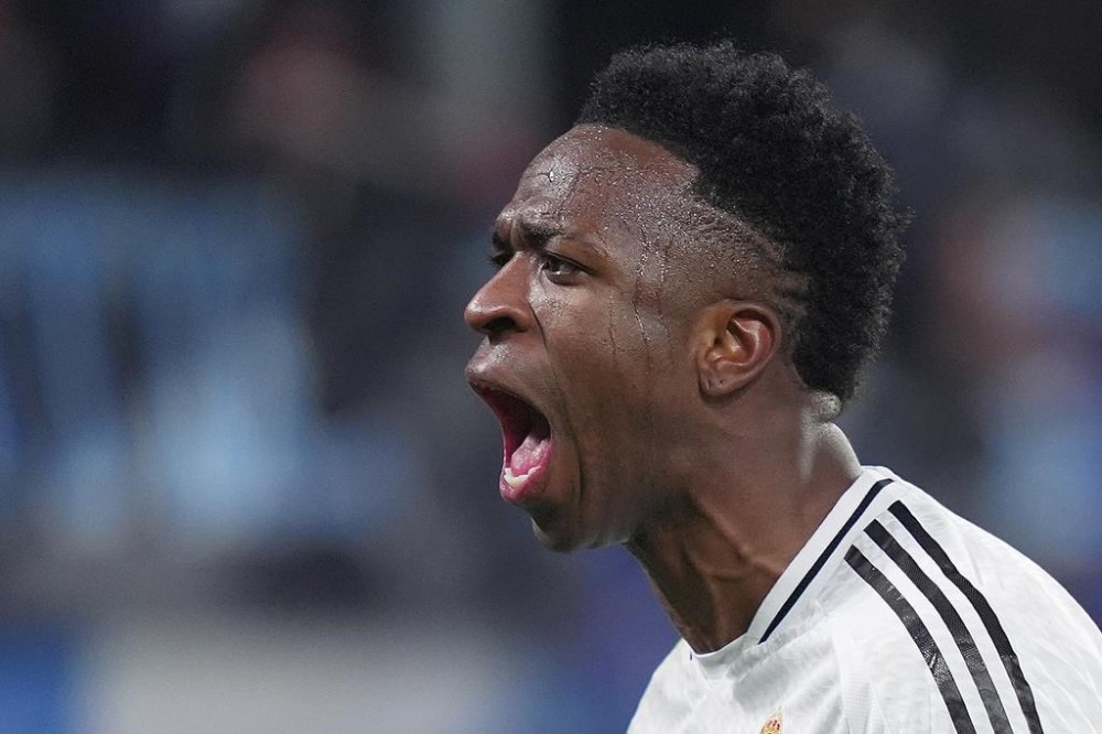 Real Madrid's Vinicius Junior celebrate after scoring during a Champions League opening phase soccer match between Atalanta and Real Madrid at the Bergamo's stadium, in Bergamo, Italy, Tuesday, Dec. 10, 2024. (Spada/LaPresse via AP)
