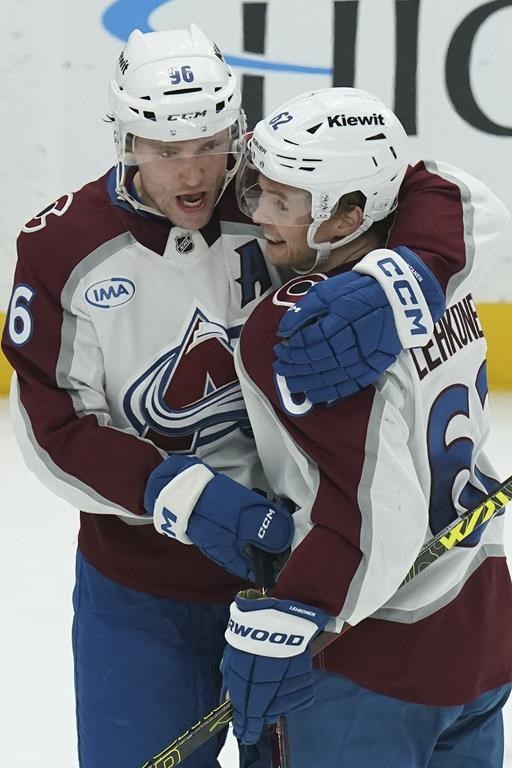 Colorado Avalanche's Artturi Lehkonen, right, celebrates with Mikko Rantanen, left, after scoring during the third period of an NHL hockey game against the Pittsburgh Penguins Tuesday, Dec. 10, 2024, in Pittsburgh. (AP Photo/Matt Freed)