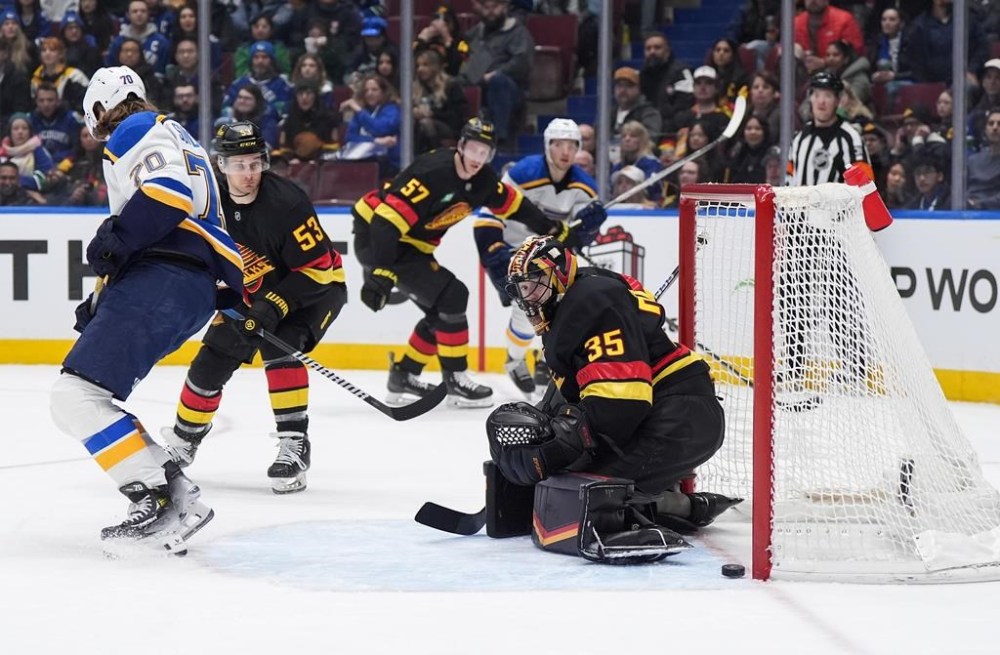 Vancouver Canucks goalie Thatcher Demko (35) watches the puck bounce back out of the net after allowing a goal to St. Louis Blues' Zack Bolduc, not seen, during the first period of an NHL hockey game in Vancouver, on Tuesday, December 10, 2024. THE CANADIAN PRESS/Darryl Dyck