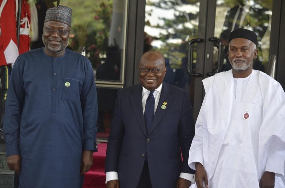 Omar Touray, president of the ECOWAS Commission, left, Ghana's President, Nana Akufo Addo, center and Nigeria Minister of Foreign Affairs, Yusuf Tuggar pose for a photo, prior to the start of the ECOWAS meeting in Abuja, Nigeria, Sunday, Dec 15, 2024. (AP Photo/Olamikan Gbemiga)