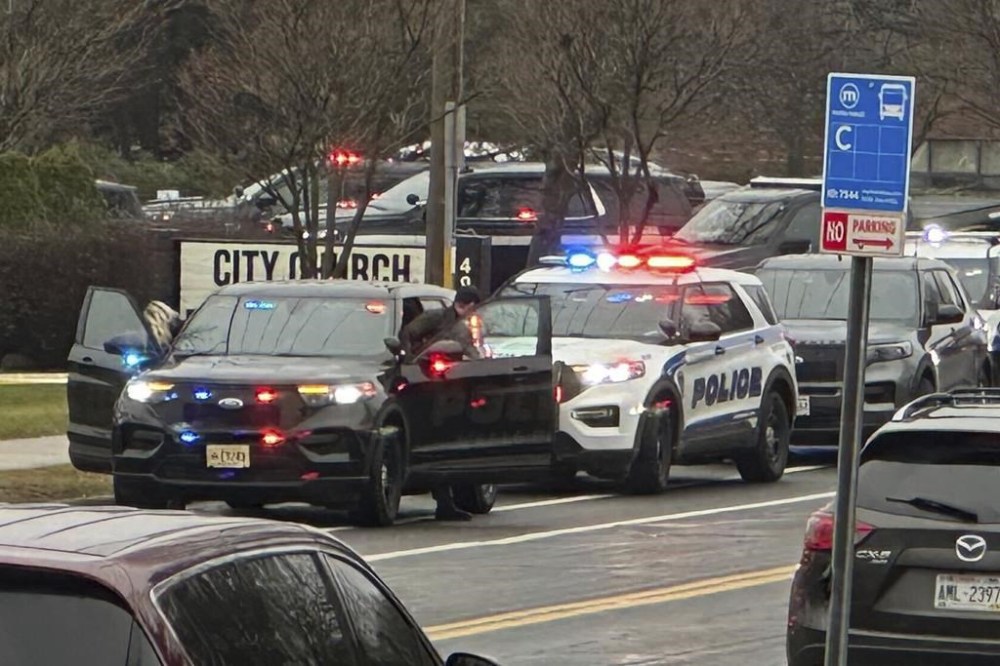 Emergency vehicles are parked outside the Abundant Life Christian School in Madison, Wis., where multiple injuries were reported following a shooting, Monday, Dec. 16, 2024. (AP Photo/Scott Bauer)