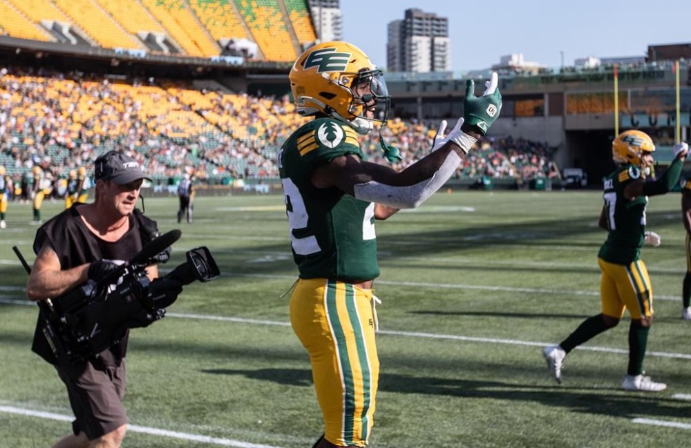 Edmonton Elks' Javon Leake (22) celebrates a touchdown against the B.C. Lions during first-half CFL action in Edmonton, Sunday, Aug. 11, 2024. THE CANADIAN PRESS/Jason Franson.