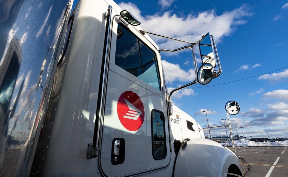 A Canada Post truck is seen at a distribution centre in Montreal on Friday, Dec.13, 2024. THE CANADIAN PRESS/Christinne Muschi