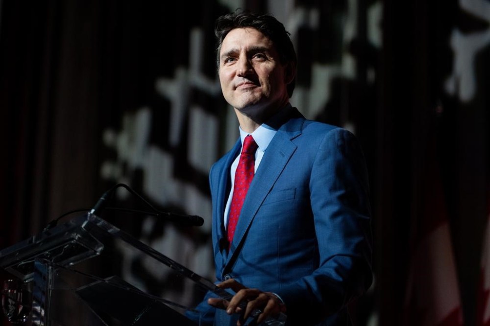 Prime Minister Justin Trudeau delivers remarks during a National Caucus holiday event in Ottawa, on Tuesday, Dec. 17, 2024.