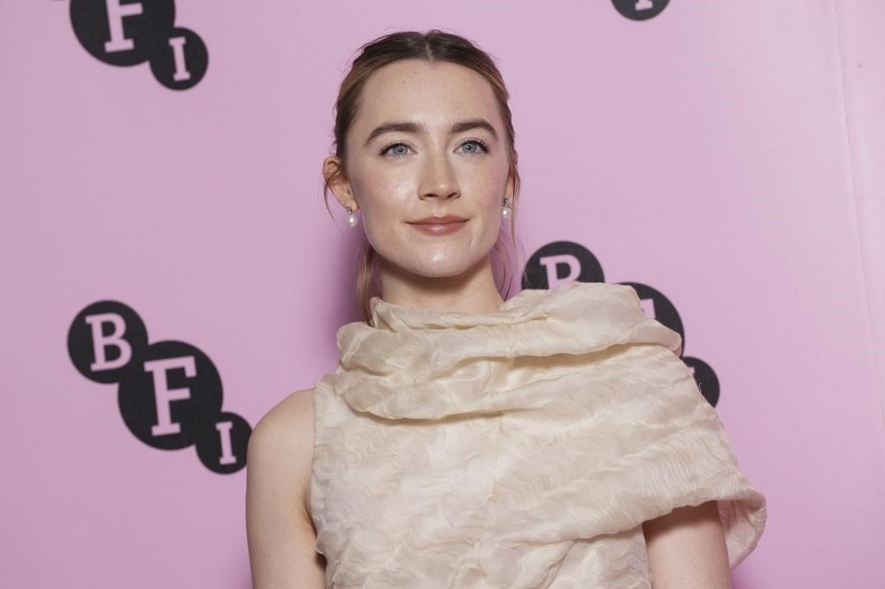 Saoirse Ronan poses for photographers upon arrival at the photo call for an 'In Conversation' event at the BFI Southbank, on Wednesday, Dec. 18, 2024, in London. (Photo by Scott A Garfitt/Invision/AP)